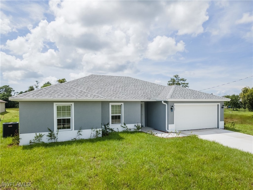 Ranch-style home featuring a front lawn, central A