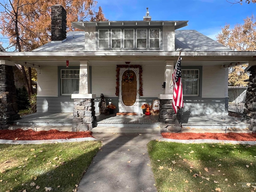 Bungalow-style house featuring a porch and a chimney