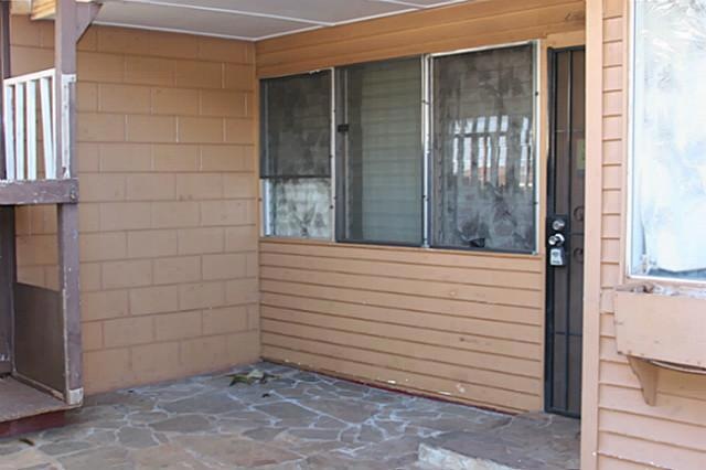 Enclosed lanai area at front entrance of home.
