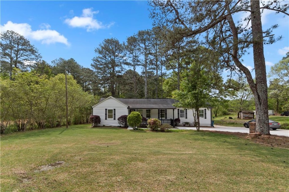 View of front of property with a front yard and a 