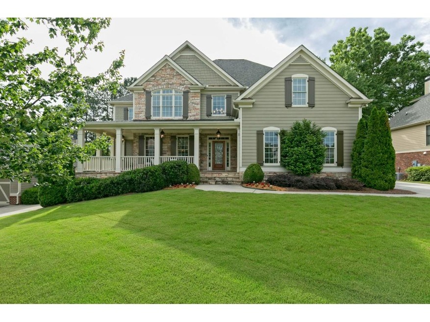 Welcome home to your wrap around stone porch!