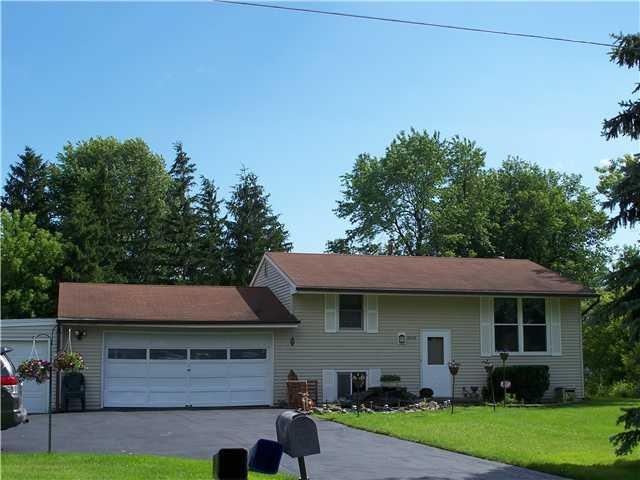 Exterior Front. Fish pond near front door. House i