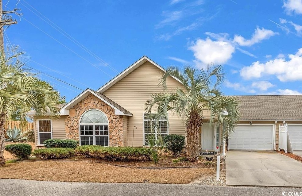 Ranch-style home featuring a garage