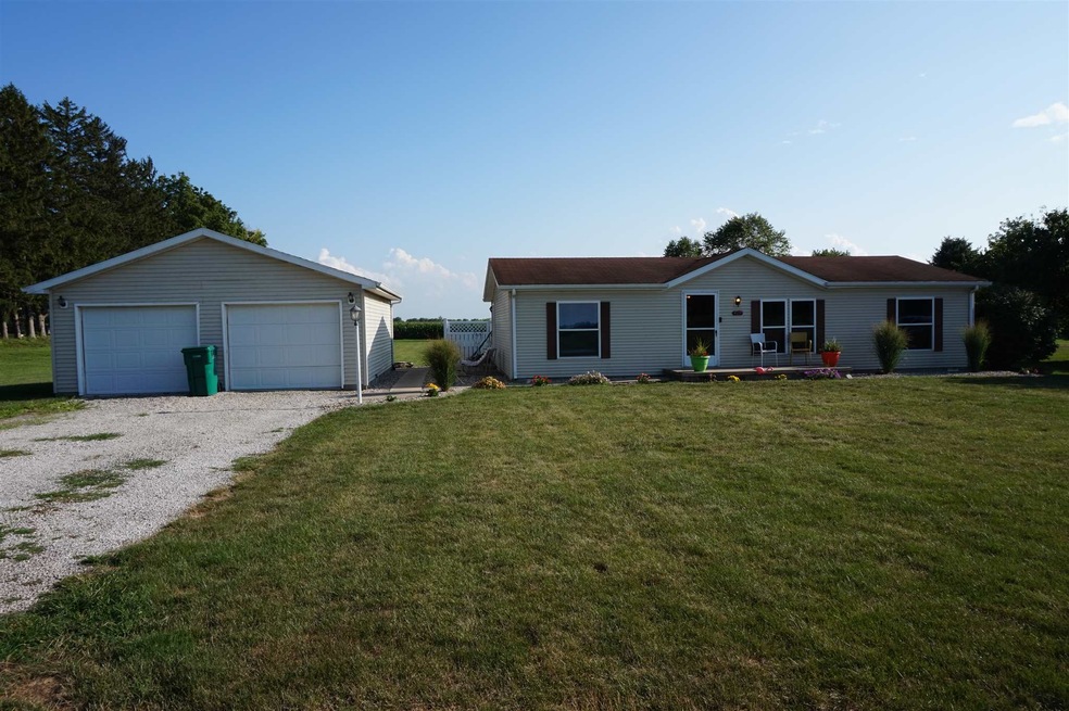 Front of shows the large front yard with the detac
