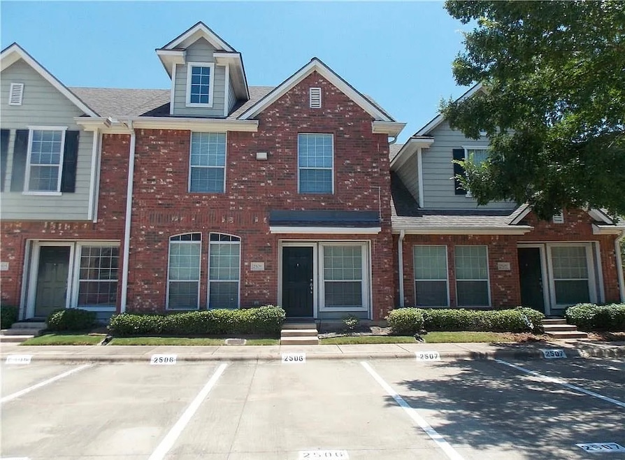Multi unit property featuring uncovered parking, b