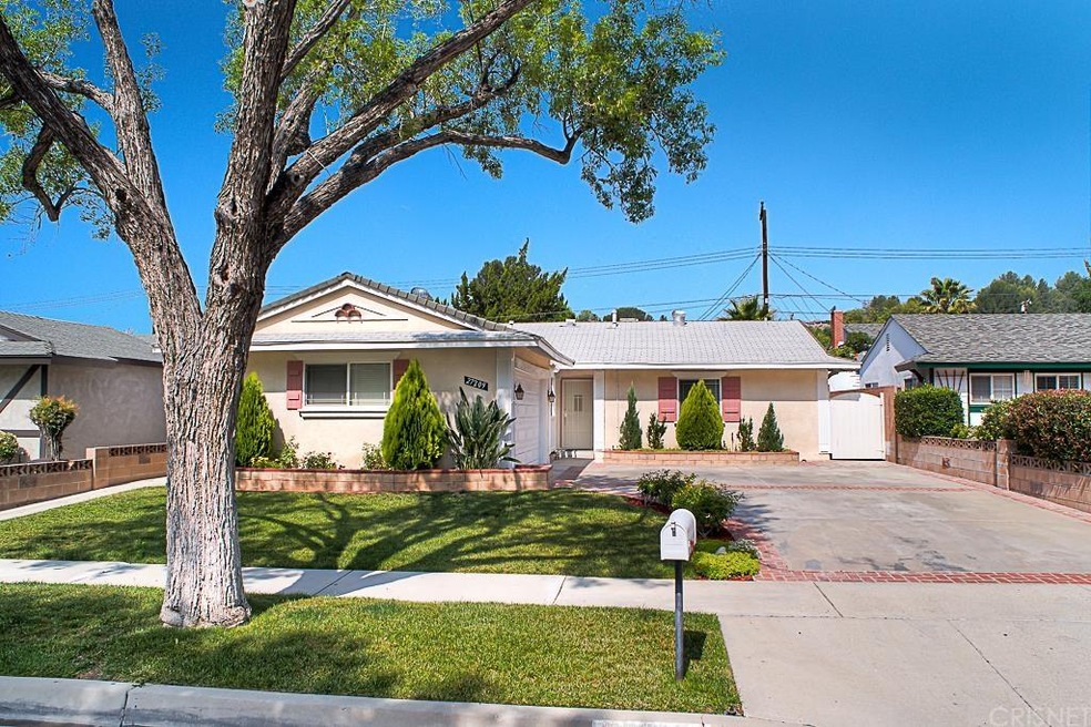 Handsome curb appeal with a cement brick ribbon driveway, a two car attached garage with direct home access, dual pane windows, copper plumbing and composition roof.