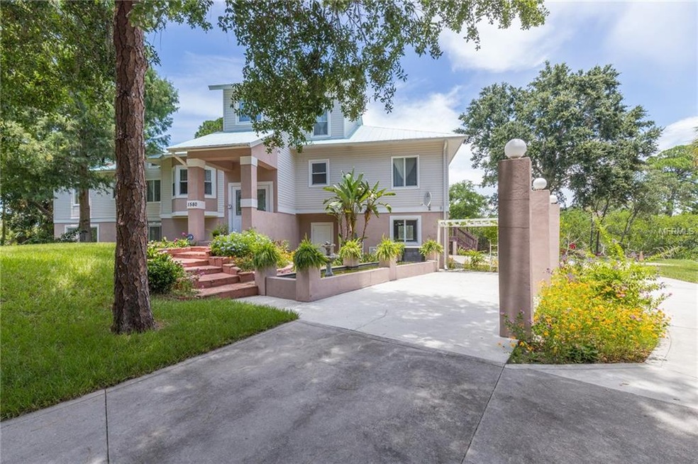 a long drivingway connects to the front porch and 