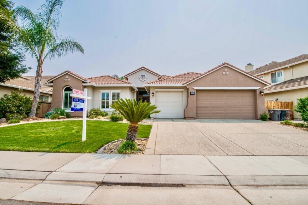 FRONT ELEVATION WITH LUSH LANDSCAPING!