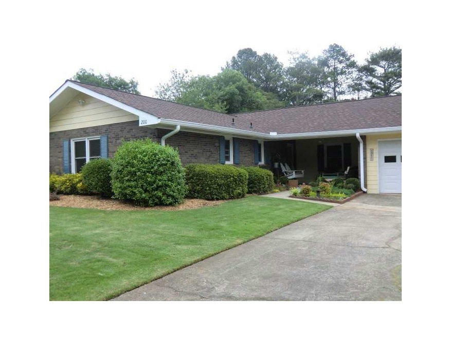 Exterior Front. Sodded Front Yard with 2 Car Garag