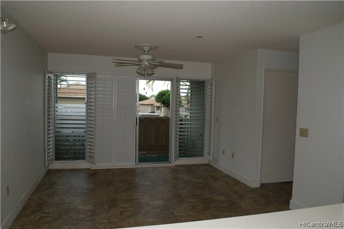 Living room opens up to partly covered lanai. Face