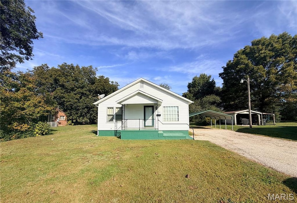 Bungalow-style home with a covered front porch.