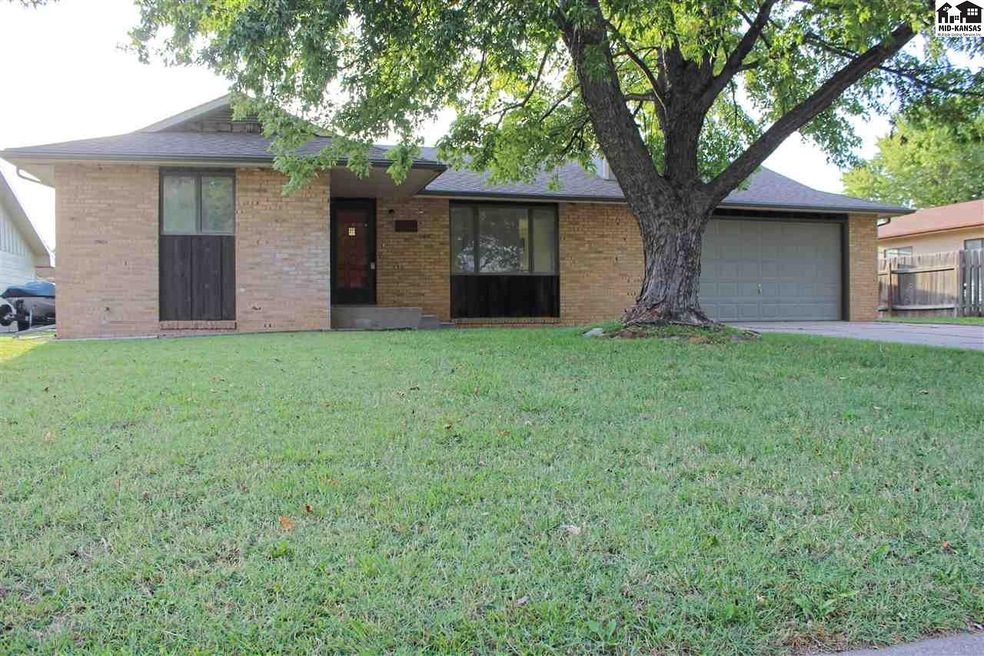 Front of house with brick and cedar