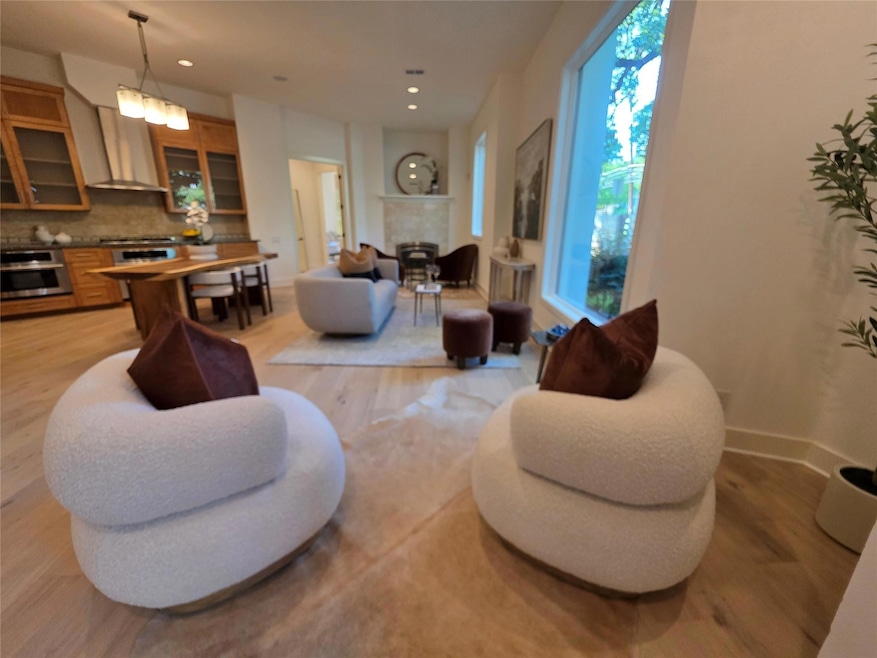 Living room with light wood-style floors, recesse