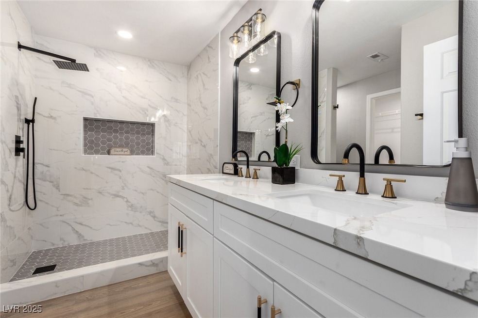 Full bath with double vanity, a marble finish show