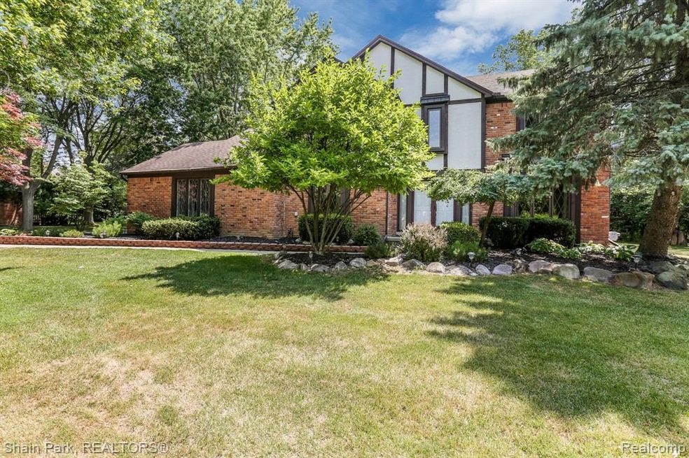 Welcome to this beautiful tudor home at 6057 Orcha