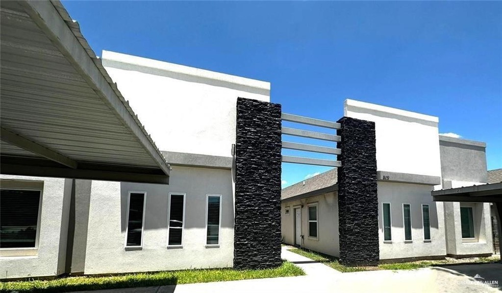 View of side of home featuring stucco siding