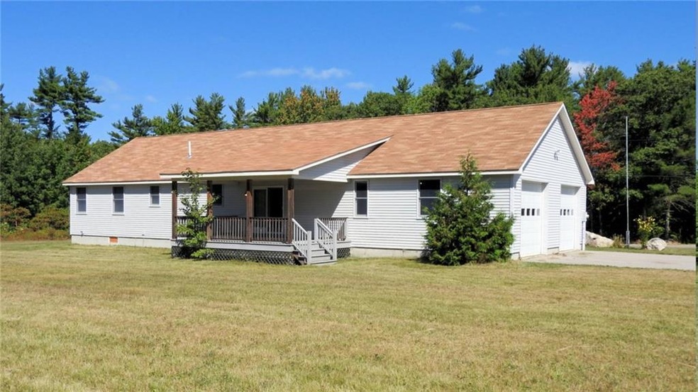 Rear Deck with a large tree lined...