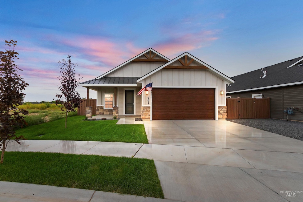Craftsman-style house with covered porch, stone siding, a garage, concrete driveway, and board and batten siding
