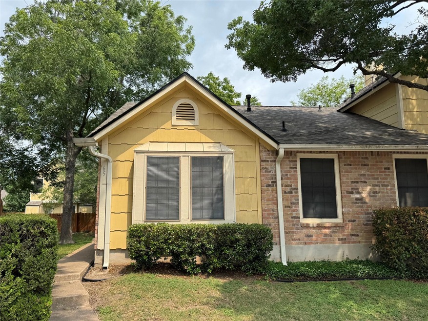 View of front of property featuring a shingled ro