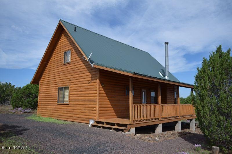 tamerron front of cabin