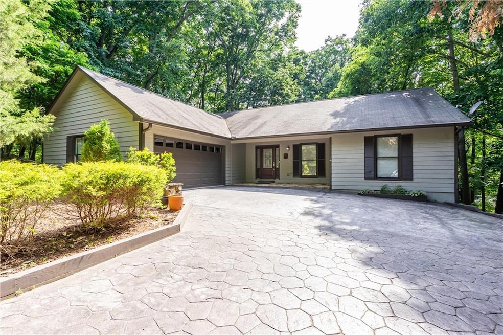 Single story home with a garage and Level Driveway