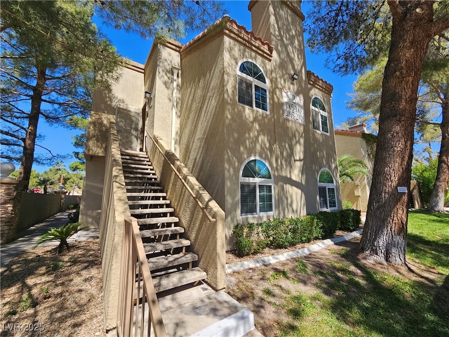 View of side of property with stucco siding, a chi