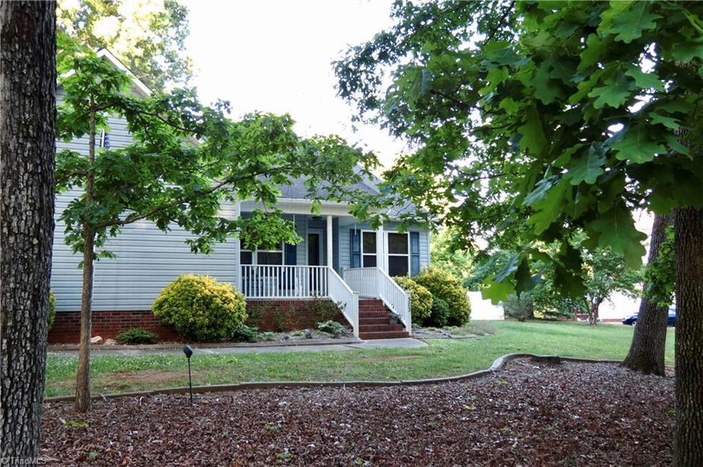 Front View - private with trees in the front on a little bit of a hill