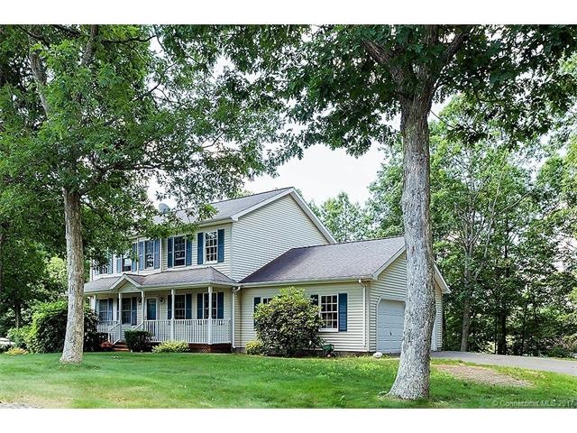 Beautiful front porch colonial with mature plantin