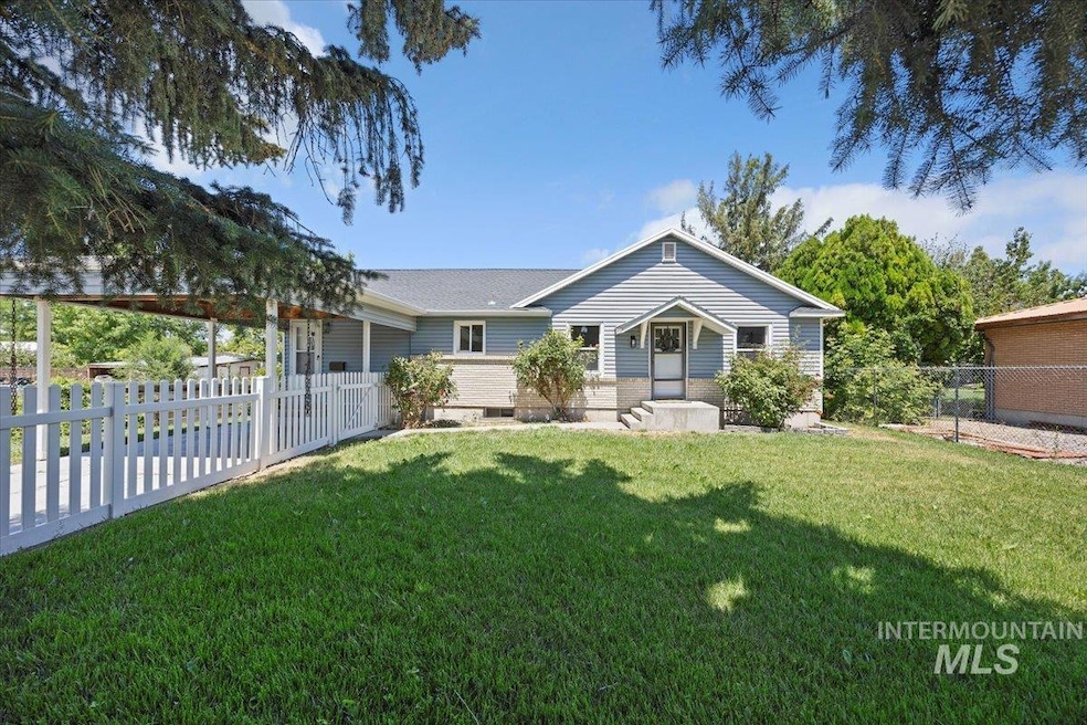 View of front of house featuring a fenced backyard