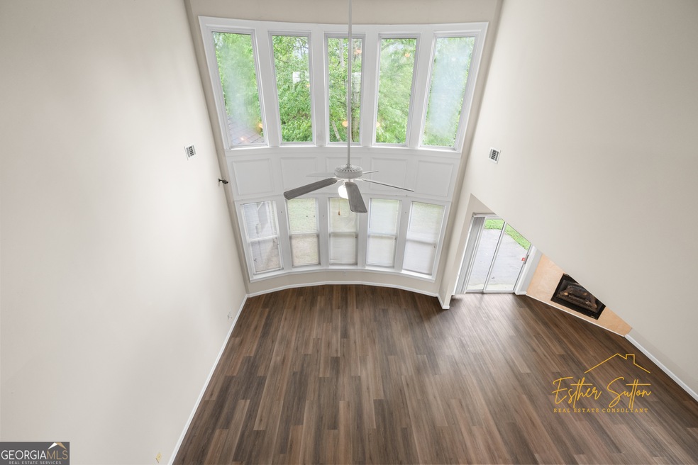 2 story living room featuring dark wood-type floor
