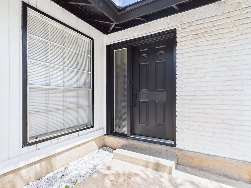 Property entrance with brick siding