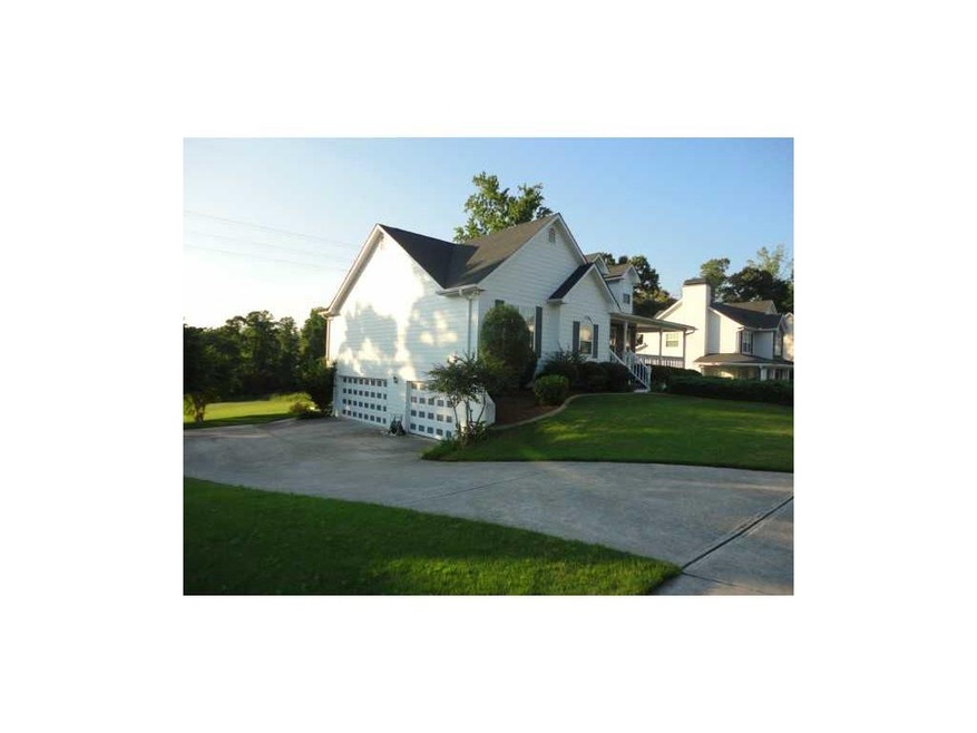 Exterior Front. Paved driveway and parking pad