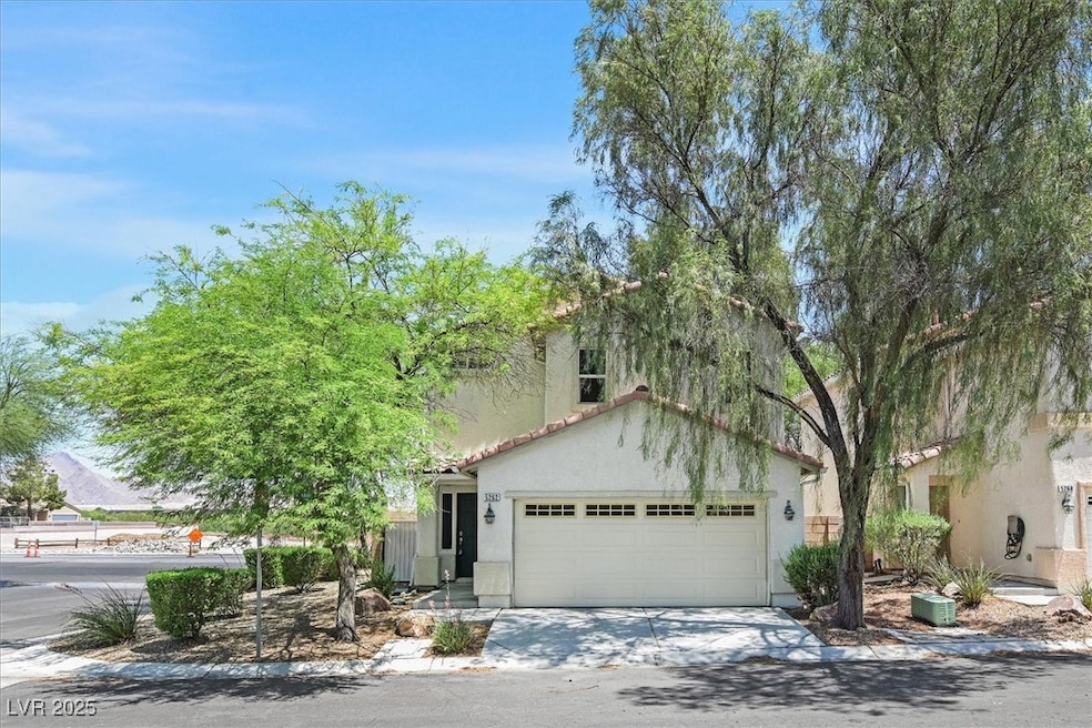 Mediterranean / spanish house featuring a tile roo