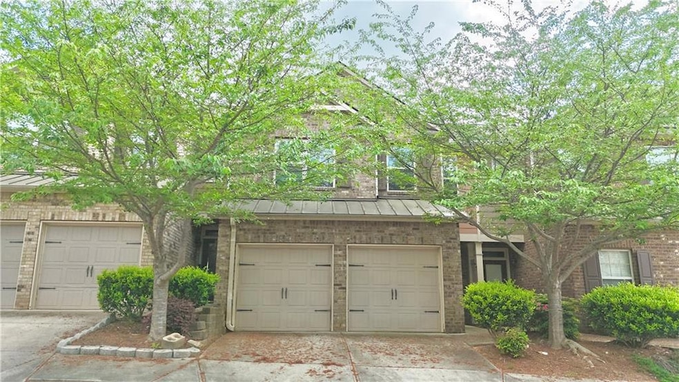 View of front of property with concrete driveway a