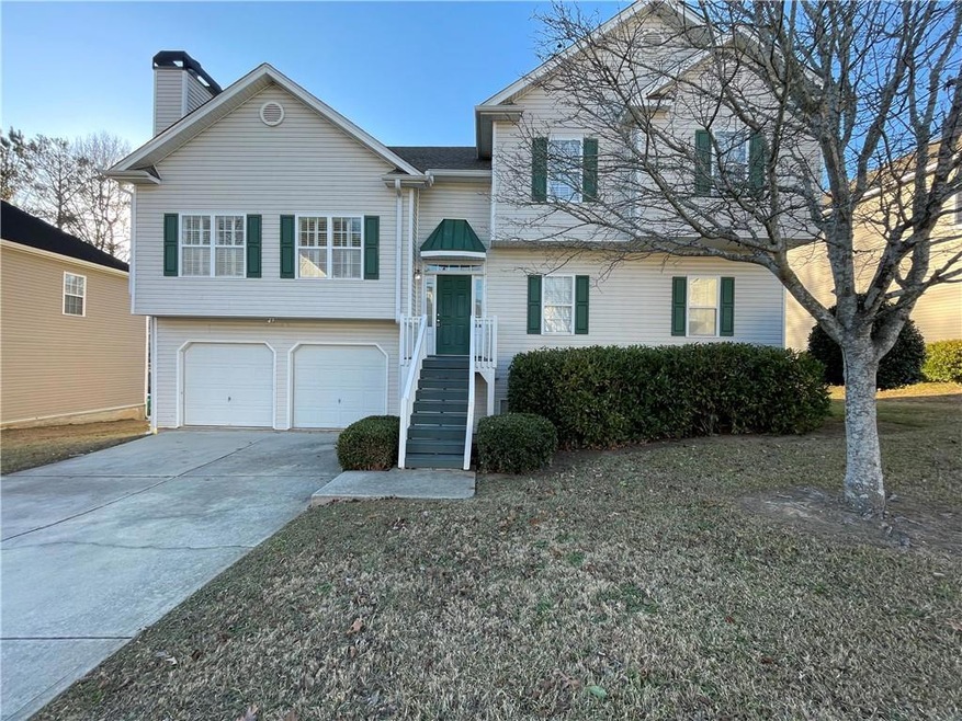 View of front facade featuring a garage