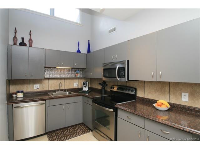 Elegant kitchen with stainless steel appliances an