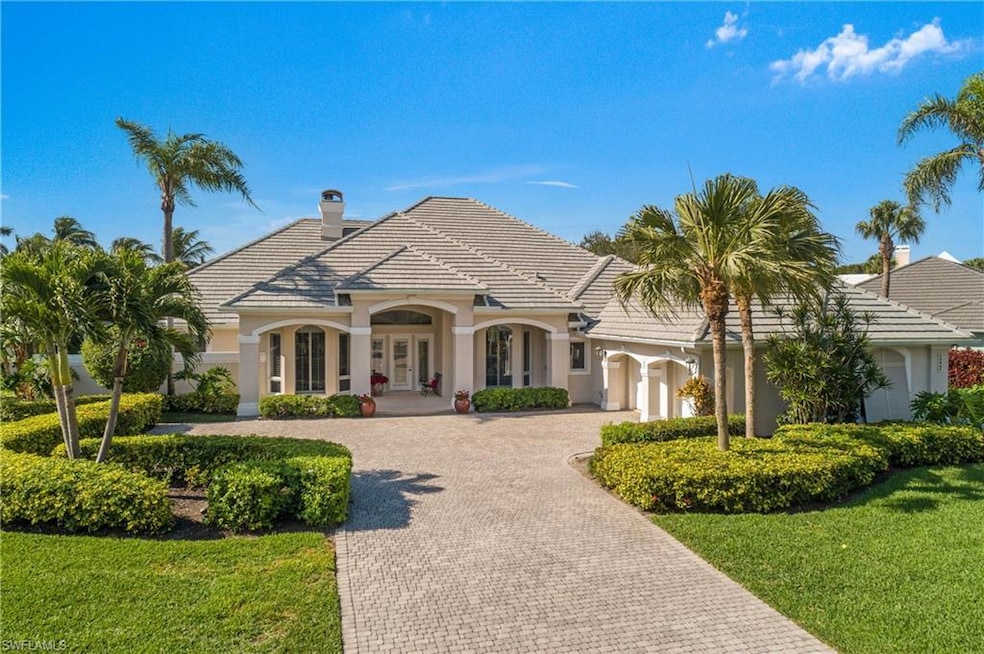 Front exterior with newer tile roof & 2 car garage