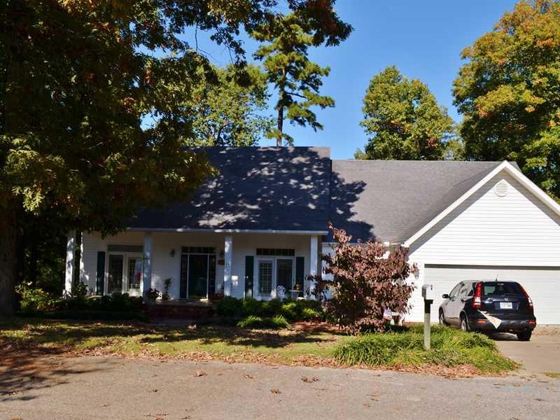 Exterior Front. Traditional looking home surrounde