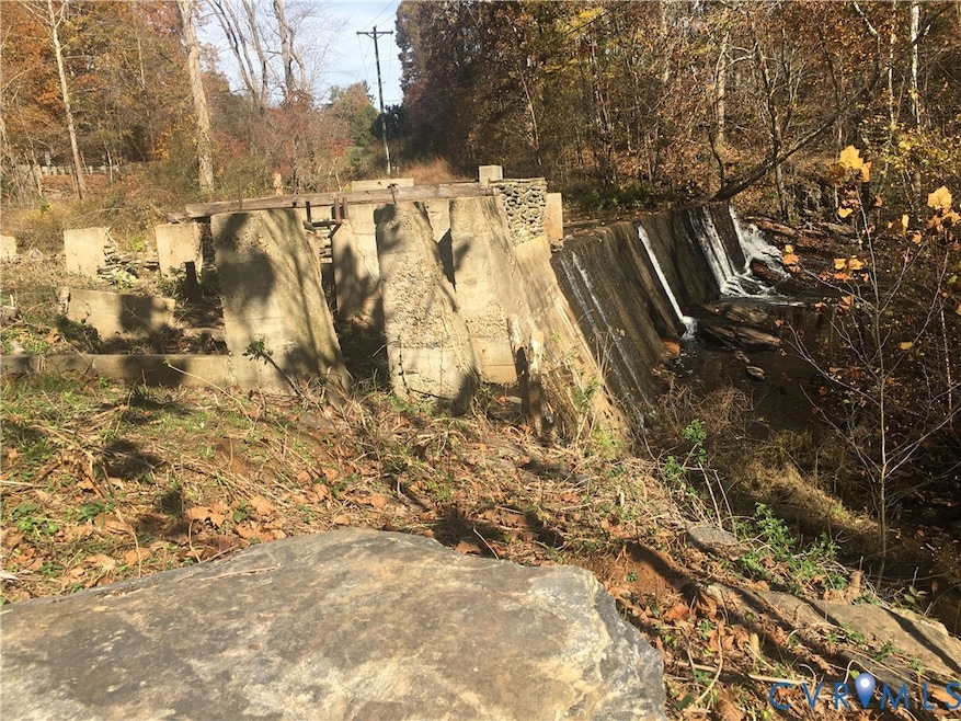 VIEW OF DAM WATERFALL AND FOUNDATION OF OLD MILL AS SEEN FROM HOME SITE FRONTING TAYLORS CREEK