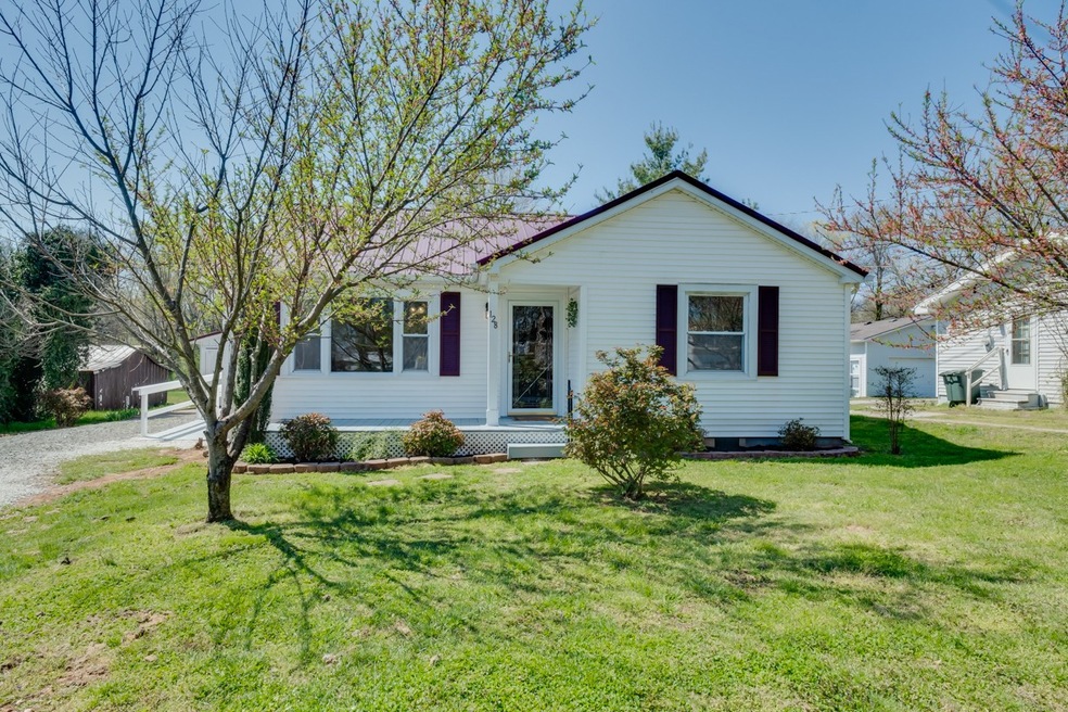 Welcome Home to 128 North St!  Completely renovated home - beautiful updates! Richland Park is within walking distance!  Outside features Metal Roof, Covered Front Porch, nice landscaping, Covered Deck on side to back, 15x19 One Car Garage/Workshop!