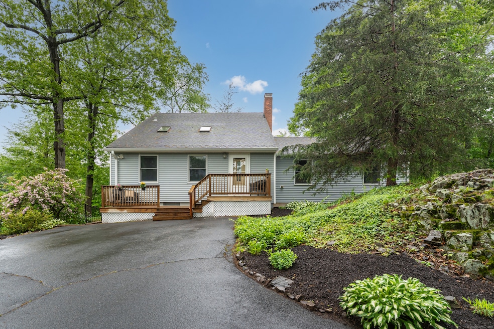 Driveway with parking leads to the front of the house.