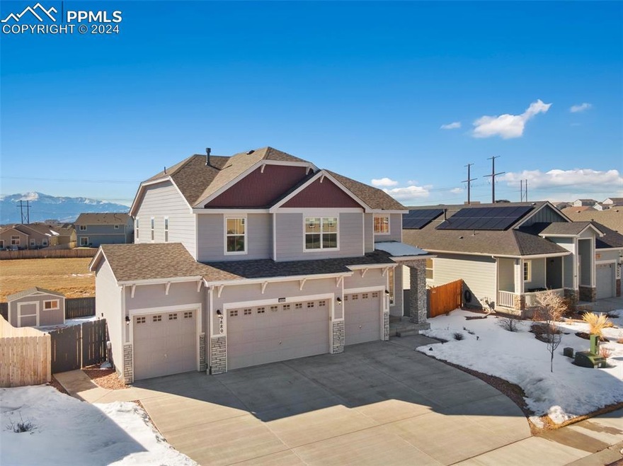 Craftsman-style house with solar panels and a gara