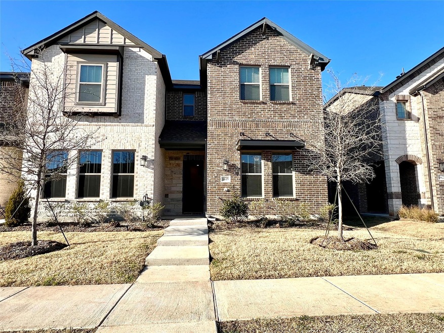 View of front of property with brick siding