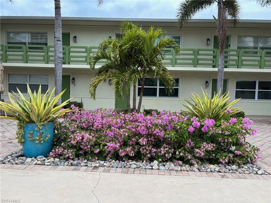 View of front of property featuring stucco siding 