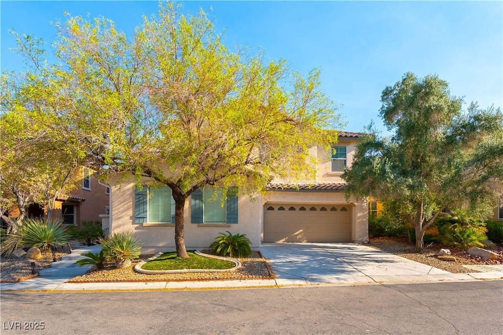 View of front of property with concrete driveway,