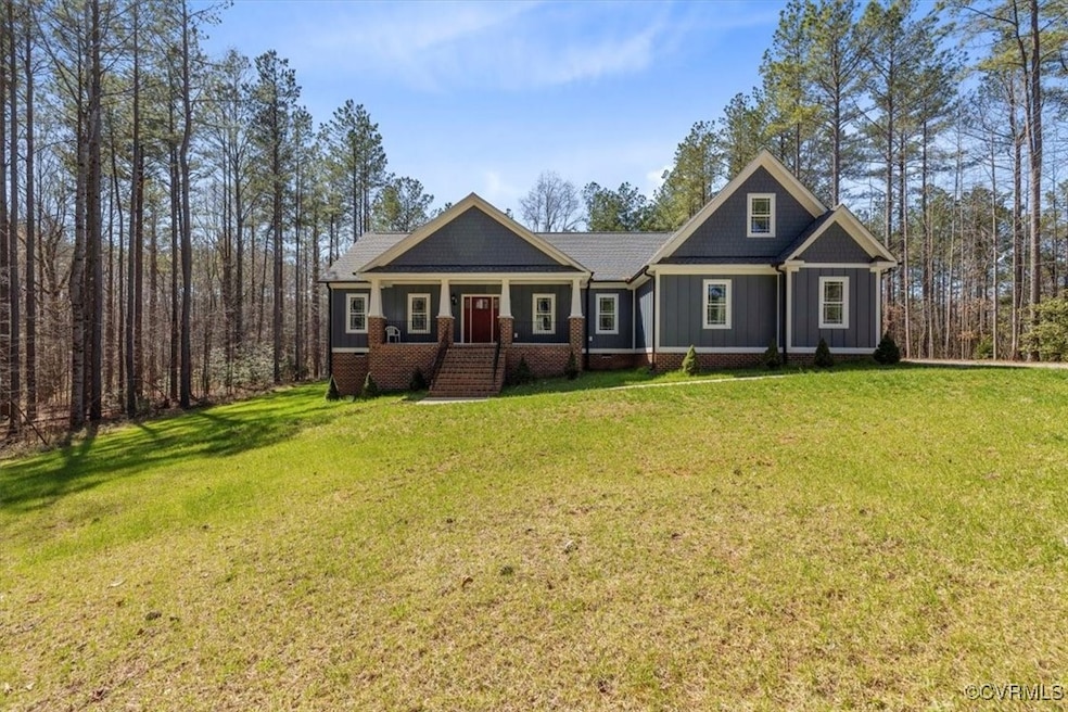 Craftsman house featuring brick siding, a front ya