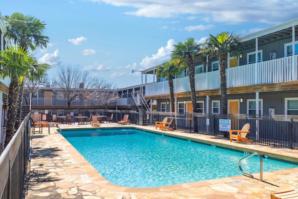 Pool featuring a patio and fence