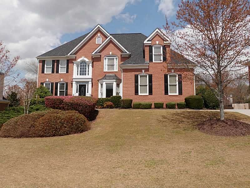 Exterior Front. Three side Brick Executive Home wi