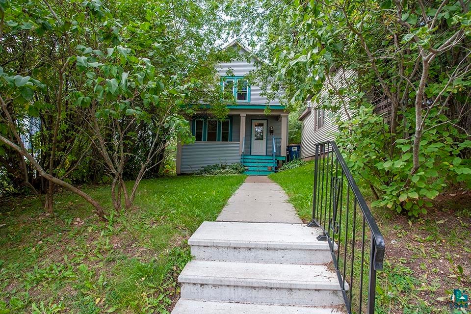 View of property hidden behind natural elements fe