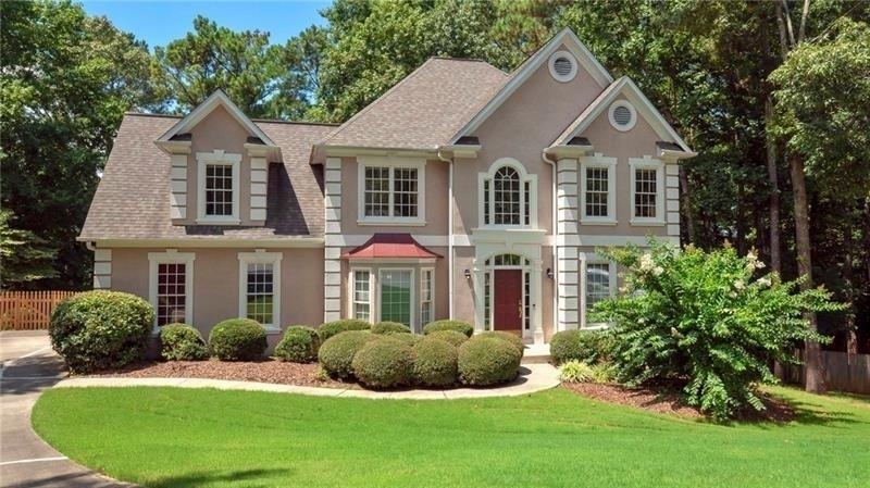 Level, cul-de-sac lot. Hardcoat stucco front eleva